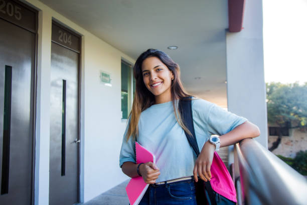 istock Latino college student out of class 1207162186