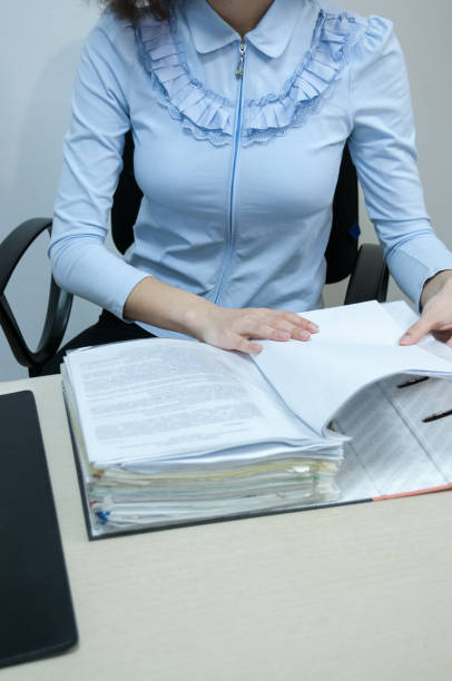 istock Office, brunette girl working with documents at the Desk 1207165579