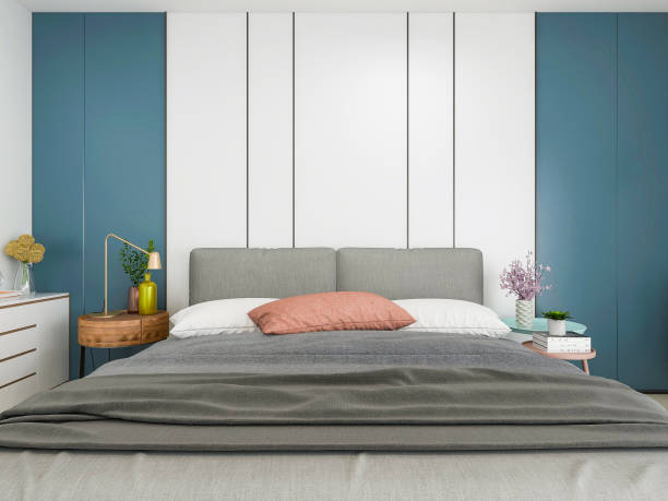 istock Spacious and modern bedroom design with carpet on the floor, TV on the front wall and floor to ceiling windows 1207171663