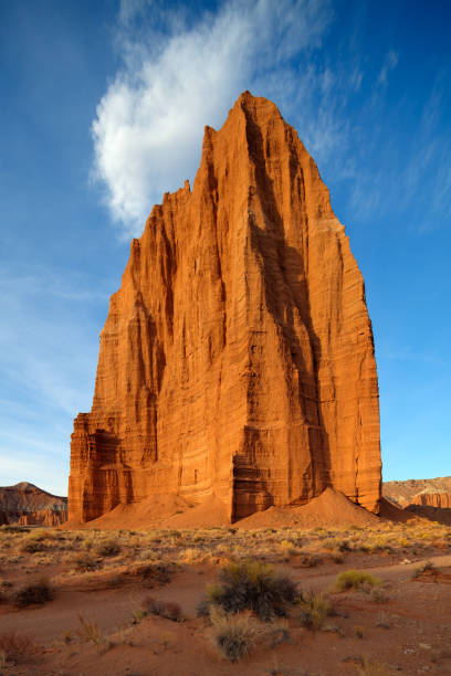 Temple of Sun and Cloud Formation Temple of the Sun, located at Capital Reef National Park in Utah. capitol reef national park stock pictures, royalty-free photos & images