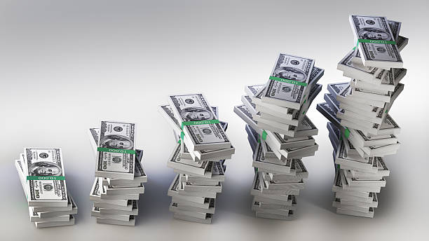 istock Many big packs of dollars over white 120717430