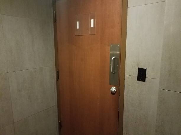 istock locked bathroom or restroom door with grey tiles 1207176790