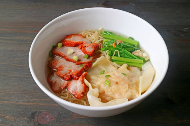 istock Delectable Roasted Pork Wonton and Egg Noodle Soup with Vegetables 1207182311