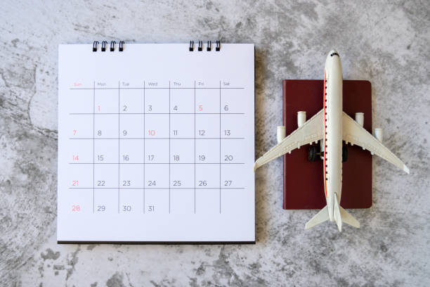 istock Airplane model with paper calendar. plan for trip 1207184982