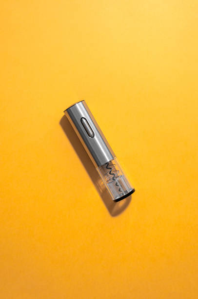 istock Electric corkscrew metallic gray color. Yellow background. Isolated. View from above. Hard light and shadow. 1207186969
