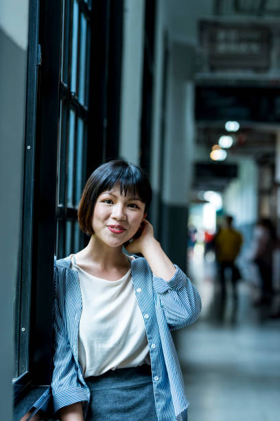 istock Female student by the window 1207188342