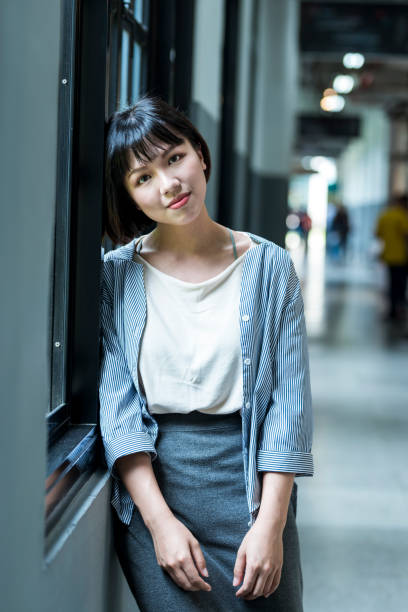 istock Female student by the window 1207188351