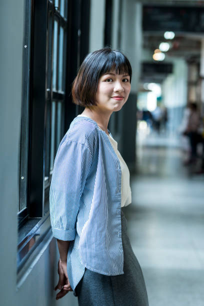 istock Female student by the window 1207188365