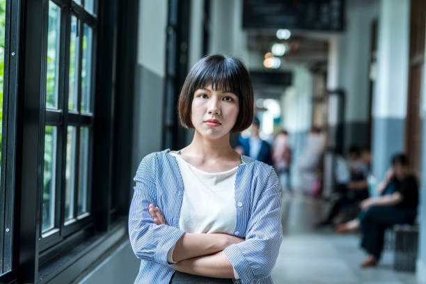 istock Female student by the window 1207188371