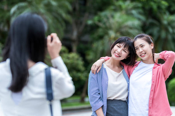 istock Girls taking commemorative photos 1207192080