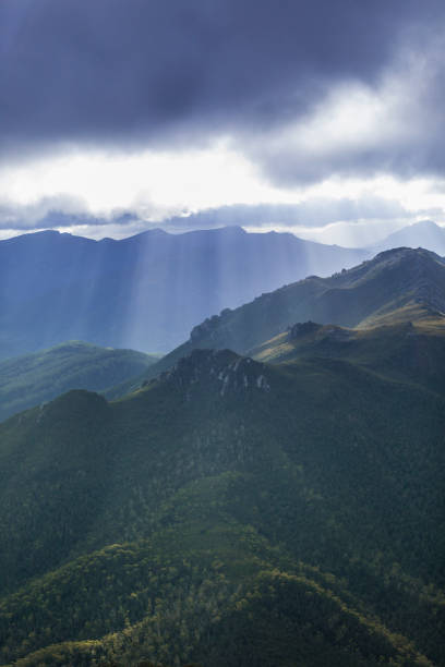 istock Heavenly light over dramatic mountains in Tasmania, Australia 1207193422
