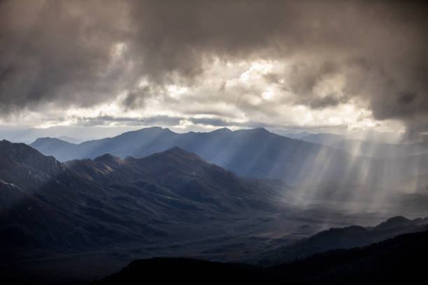 Heavenly light over dramatic mountains in Tasmania, Australia