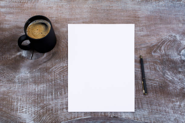 maqueta de hoja de papel en blanco con taza de cofee - paper sheet fotografías e imágenes de stock