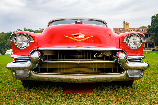 Miami, Florida USA - March 12, 2017: Close up view of the front end of a beautifully restored vintage 1956 Cadillac Series 62 convertible automobile at a public car show along Palmetto Bay in Miami.