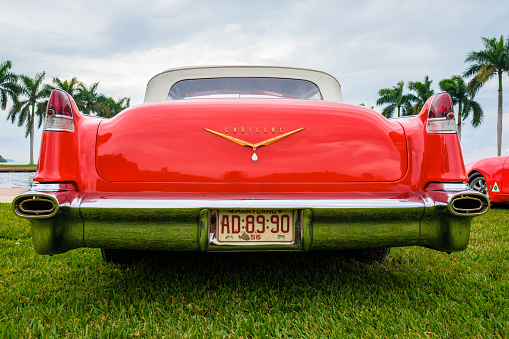 Miami, Florida USA - March 12, 2017: Close up view of the rear end of a beautifully restored vintage 1956 Cadillac Series 62 convertible automobile at a public car show along Palmetto Bay in Miami.