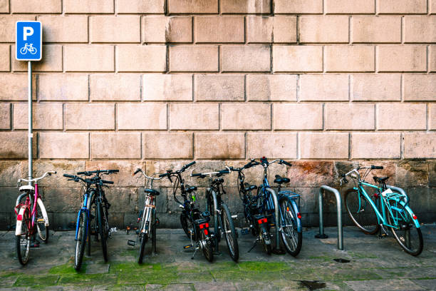 istock bicycles park in modern barcelona cityscape 1207196118