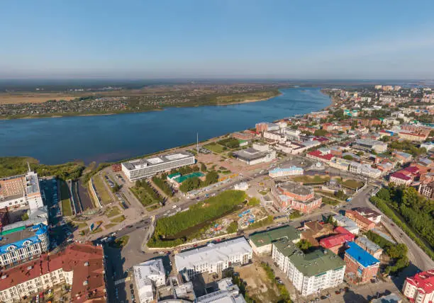 Aerial view of Tomsk city: city administration, Tom river. Summer, sunny day