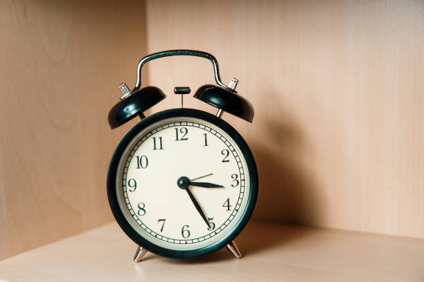 istock Retro alarm clock in black 1207202342
