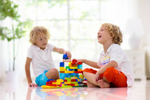istock Child playing with toy blocks. Kids play. 1207202779