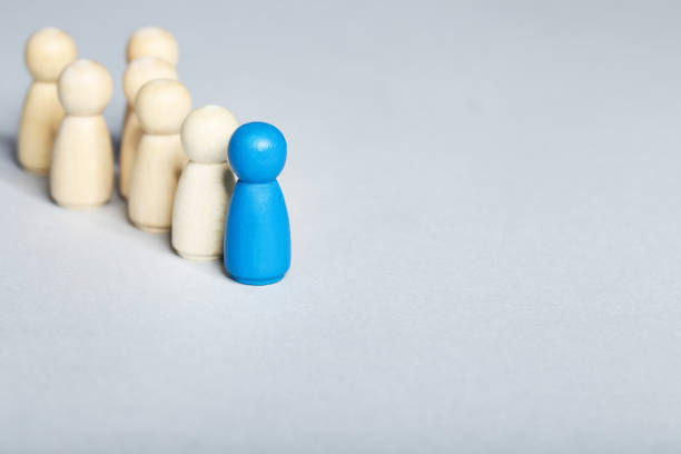 istock Leader concept. Wooden figures on gray background 1207203499