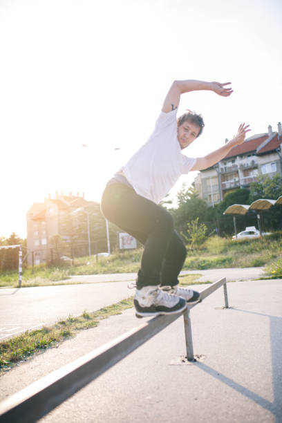 istock man roller skating on rollers makes a trick jump from the pedestal 1207204027
