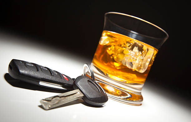 Alcoholic Drink and Car Keys stock photo