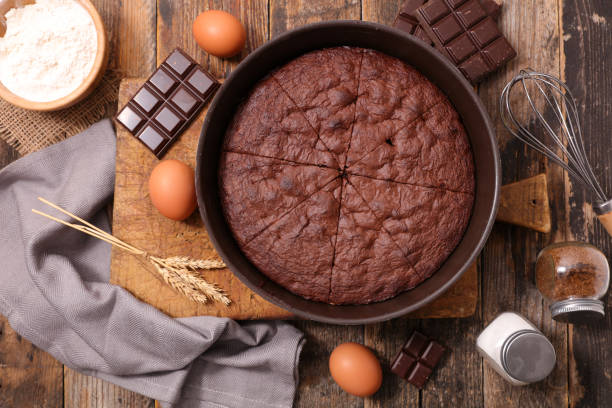 istock chocolate cake on wooden board and ingredient 1207207567