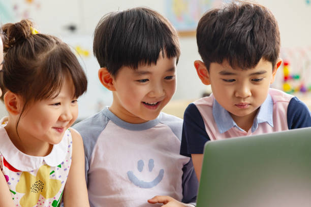 istock The kindergarten children watch video 1207208177