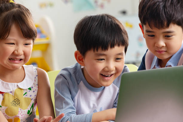 istock The kindergarten children watch video 1207208179