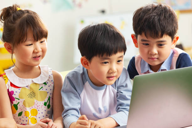 istock The kindergarten children watch video 1207208204