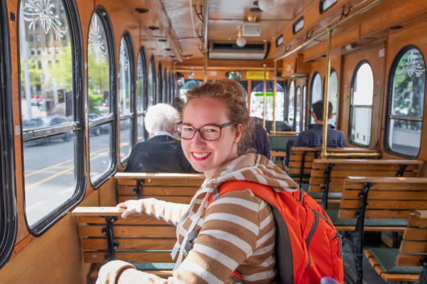 istock VANCOUVER - MAY 04 2019: Downtown Vancouver, Canada. Bus Transportation System on May 04, 2019 in Vancouver, Canada. Vancouver great accessibility for visitors,young woman and the interior of the hop on hop off bus 1207208869