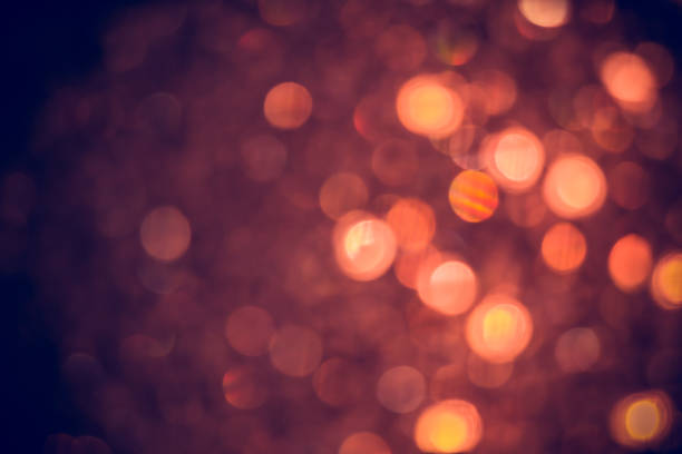 istock Bokeh orange lights in celebration as abstract background. 1207209058