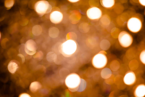 istock Bokeh golden yellow tones from light vintage celebrations as abstract background. 1207209063