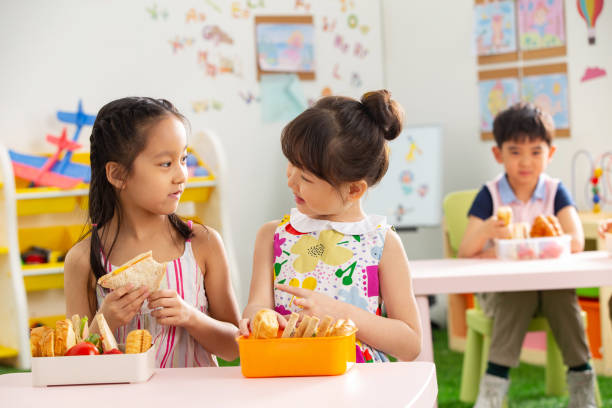 istock Kindergarten children eat 1207209290