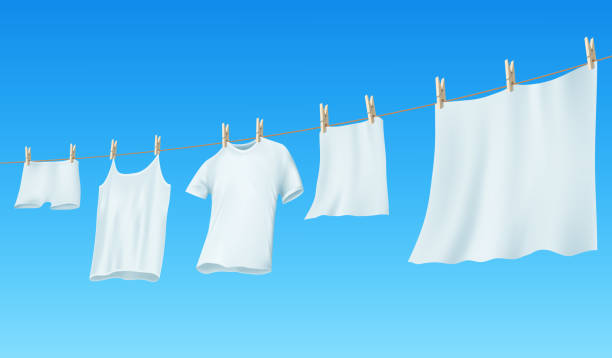 weiße sorgsame bettwäsche und kleidung hängen an einem seil - white clothing stock-grafiken, -clipart, -cartoons und -symbole