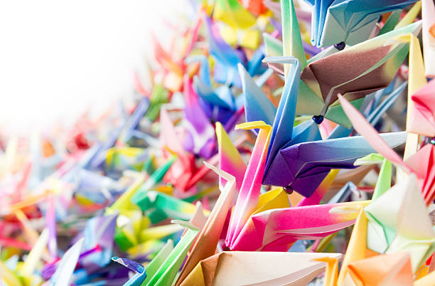 istock Paper cranes held together by fishing lines 120721140