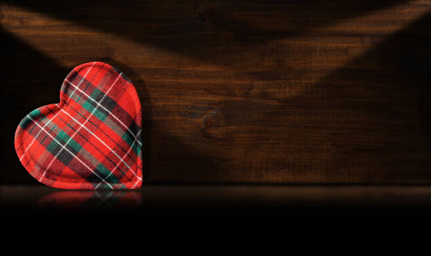 istock Fabric heart shape on a wooden background 1207211600