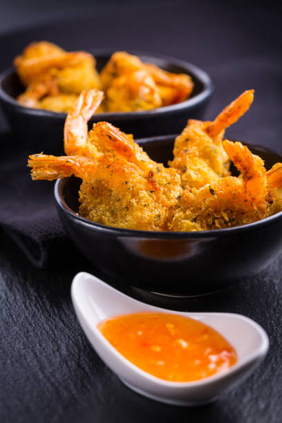 istock Roastet and breaded hot Thai shrimps with dip 1207212303