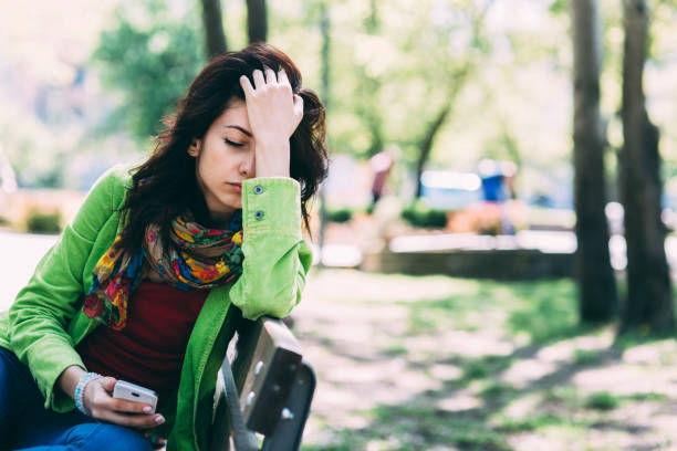 istock Relaxed woman in the park 1207212322