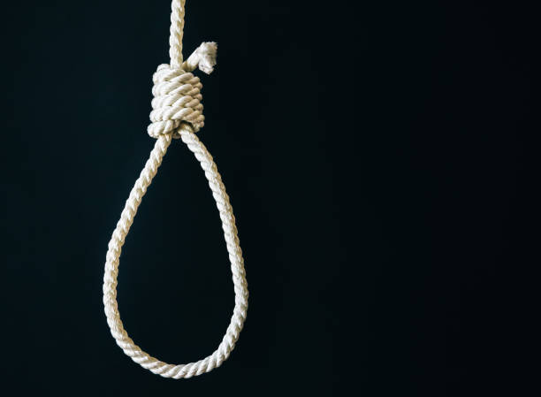 istock Noose on black background. Suicide concept. Hanging because of work stress. Depression of burnout. Terrible life situation. 1207213599