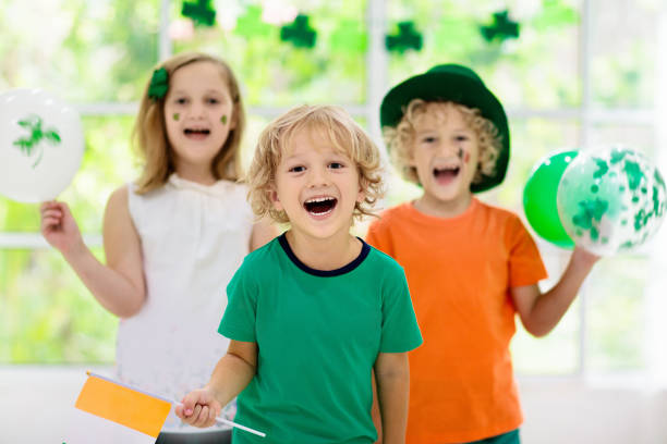 istock Kids celebrate St Patrick Day. Irish holiday. 1207217327