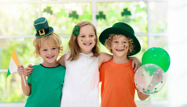 istock Kids celebrate St Patrick Day. Irish holiday. 1207217979