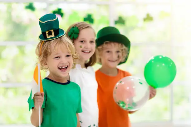 Photo of Kids celebrate St Patrick Day. Irish holiday.