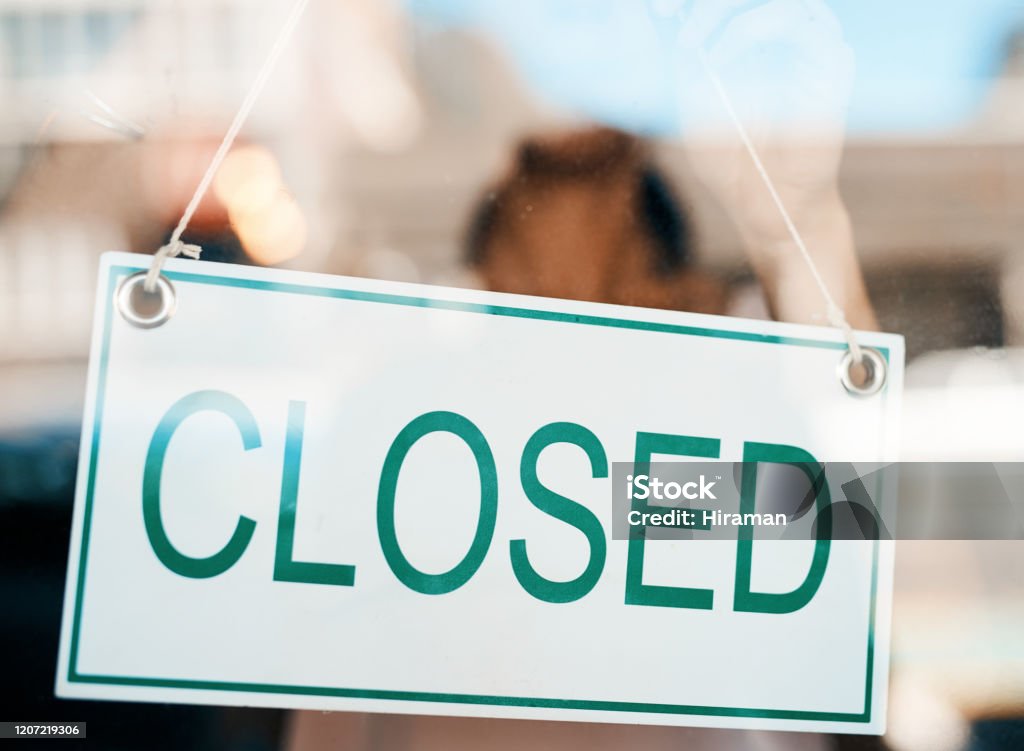 We’ll be right back with more of your favourites Shot of a an open sign on the door of a store Closed Sign Stock Photo