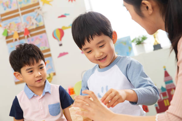 istock Kindergarten teachers and the children 1207224595