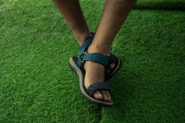 istock leg wearing sport sandals 1207226335