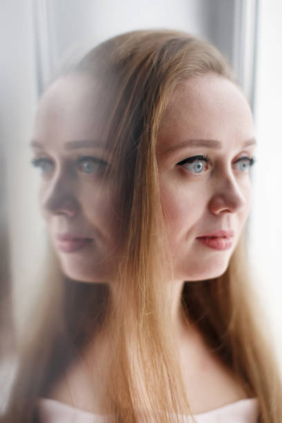 istock Two-faced conceptual portrait of young attractive woman, close-up 1207228607