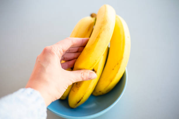 istock banana bunch close up on the kitchen table 1207231379