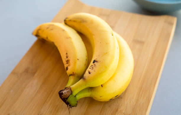 istock banana bunch close up on the kitchen table 1207231390