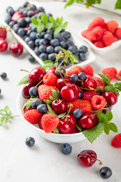 istock Various juicy berries with leaves. 1207231742